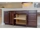 Custom kitchen cabinetry with pull-out shelving and ample storage at 1377 Sw 161St Pl, Ocala, FL 34473