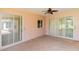 This lanai features tile floors, sliding glass doors, and plenty of space for outdoor seating at 1377 Sw 161St Pl, Ocala, FL 34473