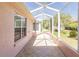 Relax in the screened lanai, featuring tile floors and a view of the outdoors at 1377 Sw 161St Pl, Ocala, FL 34473