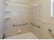 This shower has grab bars and tiled walls at 1377 Sw 161St Pl, Ocala, FL 34473