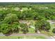 Expansive property showcasing a pool, solar panels, and lush greenery, all within a clearly defined property boundary at 16 Count Fleet Dr, Ocala, FL 34482