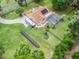 Expansive property with a home featuring solar panels, screened pool, RV parking, and storage shed at 16 Count Fleet Dr, Ocala, FL 34482