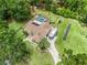 Aerial view of the property featuring a pool, solar panels, and a large RV at 16 Count Fleet Dr, Ocala, FL 34482