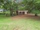 Property with barn featuring multiple stalls and fencing at 16 Count Fleet Dr, Ocala, FL 34482