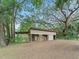 Equestrian barn with open stalls and ample space for storage at 16 Count Fleet Dr, Ocala, FL 34482