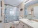 Inviting bathroom has decorative glass in the shower, a sink vanity, and serene ambiance at 16 Count Fleet Dr, Ocala, FL 34482