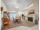 Cozy dining area with a fireplace, traditional furnishings, and an open layout to a living area at 16 Count Fleet Dr, Ocala, FL 34482