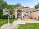 Charming exterior showcases a well-maintained facade with brick accents, manicured landscaping, and inviting entrance at 16 Count Fleet Dr, Ocala, FL 34482
