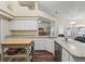 Bright kitchen featuring granite counters, stainless steel appliances and a convenient mobile island at 16 Count Fleet Dr, Ocala, FL 34482