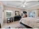 Spacious bedroom boasts tray ceilings, tiled floor, access to the lanai, and a relaxing atmosphere at 16 Count Fleet Dr, Ocala, FL 34482