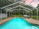 Backyard pool and spa inside enclosure at 16 Count Fleet Dr, Ocala, FL 34482