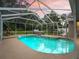Screened-in pool and spa offer a serene outdoor experience at 16 Count Fleet Dr, Ocala, FL 34482