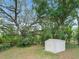 White storage shed in the backyard at 16 Count Fleet Dr, Ocala, FL 34482