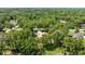 Secluded property with mature trees, lush landscaping, long driveway, and a private setting at 1675 Se 73Rd Pl, Ocala, FL 34480