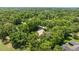 Secluded property boasts mature trees, lush landscaping, privacy, and convenient neighborhood access at 1675 Se 73Rd Pl, Ocala, FL 34480