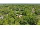 Aerial view of the property amidst lush greenery and trees at 1675 Se 73Rd Pl, Ocala, FL 34480