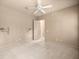Neutral bedroom showcasing a ceiling fan, plush carpeting, and neutral paint at 1675 Se 73Rd Pl, Ocala, FL 34480