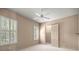 Inviting bedroom featuring plantation shutters and a walk-in closet at 1675 Se 73Rd Pl, Ocala, FL 34480
