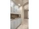 Charming butler's pantry features granite countertops, white cabinets, and sink at 1675 Se 73Rd Pl, Ocala, FL 34480