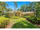 Beautiful exterior view showcasing lush landscaping and well-manicured lawn at 1675 Se 73Rd Pl, Ocala, FL 34480