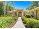 Beautiful home featuring well-manicured landscaping, double doors, and stately columns at 1675 Se 73Rd Pl, Ocala, FL 34480