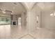 Spacious living room featuring a fireplace, archways and a view to the pool area at 1675 Se 73Rd Pl, Ocala, FL 34480