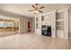 Living room featuring a built-in entertainment center and access to the outdoor lanai at 1675 Se 73Rd Pl, Ocala, FL 34480