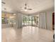 Open living room offering views of the pool and a screened outdoor living space at 1675 Se 73Rd Pl, Ocala, FL 34480