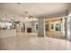 Open-concept living space with access to the kitchen, patio, and outdoor kitchen area at 1675 Se 73Rd Pl, Ocala, FL 34480