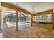 Large outdoor patio featuring outdoor kitchen, view of pool, and octagonal tile flooring at 1675 Se 73Rd Pl, Ocala, FL 34480