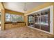 Spacious outdoor patio with full kitchen, stainless steel grill, and view of a screened-in pool at 1675 Se 73Rd Pl, Ocala, FL 34480