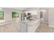 Well-lit kitchen area with granite countertops, stainless steel appliances, and seamless access to the dining space at 21301 Sw Rainbow Lakes Blvd, Dunnellon, FL 34431