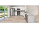 Modern kitchen featuring stainless steel appliances, granite countertops, ample cabinet space, and hardwood flooring at 21301 Sw Rainbow Lakes Blvd, Dunnellon, FL 34431