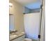 Bathroom featuring a vanity with granite countertops and a shower with tile at 2215 Ne 16Th Ct, Ocala, FL 34470