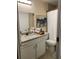 Bathroom featuring a granite countertop, vanity with storage, and shower with a curtain at 2215 Ne 16Th Ct, Ocala, FL 34470