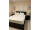 This bedroom boasts a comfortable bed, bedside tables, and artwork, creating a cozy and inviting atmosphere to unwind at 2215 Ne 16Th Ct, Ocala, FL 34470