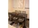 Stylish dining area featuring a modern dark wood table and comfortable seating at 2215 Ne 16Th Ct, Ocala, FL 34470
