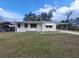 Charming single-story home featuring a covered carport and front yard at 2215 Ne 16Th Ct, Ocala, FL 34470