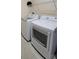 Laundry room featuring a side-by-side washer and dryer and shelving at 2215 Ne 16Th Ct, Ocala, FL 34470