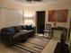 Cozy living room featuring neutral colors, modern decor, and ample natural light at 2215 Ne 16Th Ct, Ocala, FL 34470