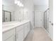 Bright bathroom with a double vanity, modern fixtures, and a glass-enclosed shower at 2254 Amberly Ave, Orlando, FL 32833