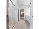 A bathroom featuring a glass-enclosed shower, modern fixtures, and neutral tiling at 2254 Amberly Ave, Orlando, FL 32833
