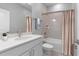 Well-lit bathroom with a vanity, sleek fixtures, and a combined tub and shower at 2254 Amberly Ave, Orlando, FL 32833
