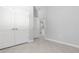 A bedroom features tile floors, neutral walls and white doors with hardware at 2254 Amberly Ave, Orlando, FL 32833