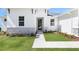 Close up of the front door of a charming one-story home with manicured lawn at 2254 Amberly Ave, Orlando, FL 32833