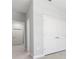 Bright hallway with a tiled floor, white walls and doors leading to other rooms at 2254 Amberly Ave, Orlando, FL 32833