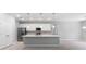 Open kitchen featuring white cabinets, stainless steel appliances, and a large island at 2254 Amberly Ave, Orlando, FL 32833