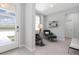 Bright living room featuring two chairs, a window, and tile floors at 2254 Amberly Ave, Orlando, FL 32833