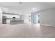 Spacious open-concept living room featuring tile floors and a sliding glass door at 2254 Amberly Ave, Orlando, FL 32833