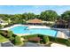 Large community pool is surrounded by mature landscaping with ample seating and a large clubhouse at 2417 Se 23Rd St, Ocala, FL 34471